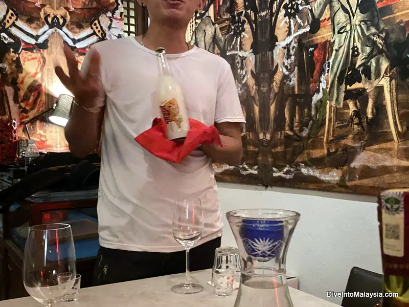 Trying coconut wine Penang food tour